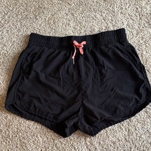 Stylish Black Athletic Shorts with Pink Accent